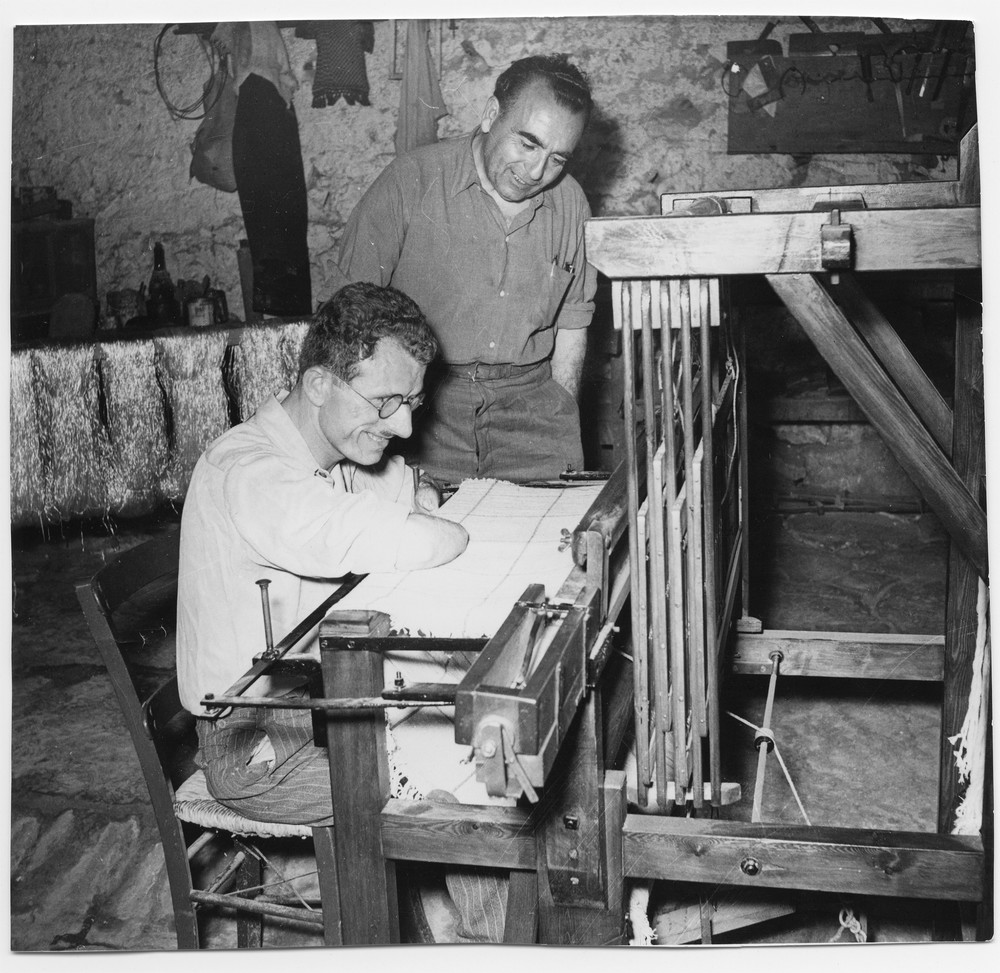 Antonio Pantoulas, a Greek farmer who lost both of his arms and his sight when he stepped on a landmine in 1947, works at an adapted loom constructed for his use. Athens, 1955.
