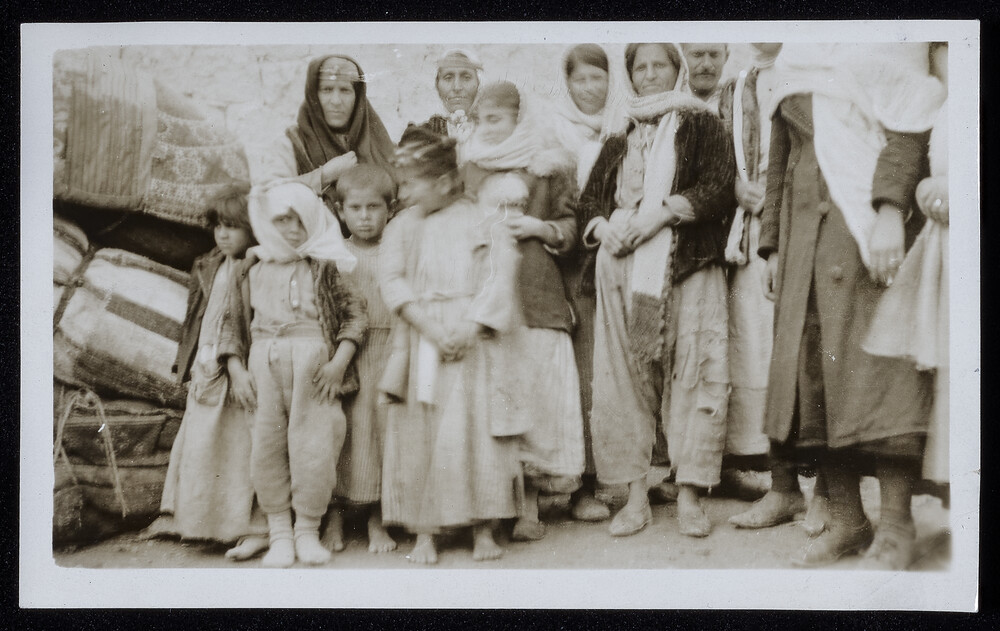 Refugee family with its bundles, Caucasus, 1920s