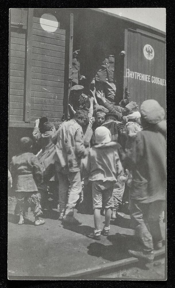 Children boarding a Russian boxcar, early 1920s