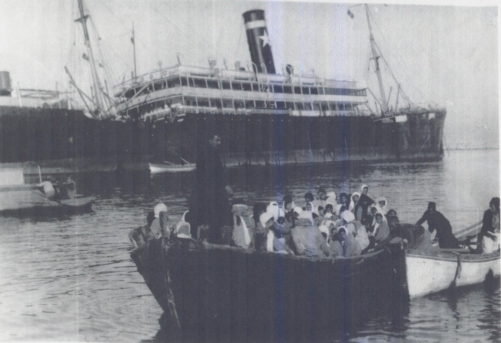 Orphans being taken by lighter from the Beirut harbor to a chartered steamer for transfer to another NER orphanage along the coast, c. 1922.