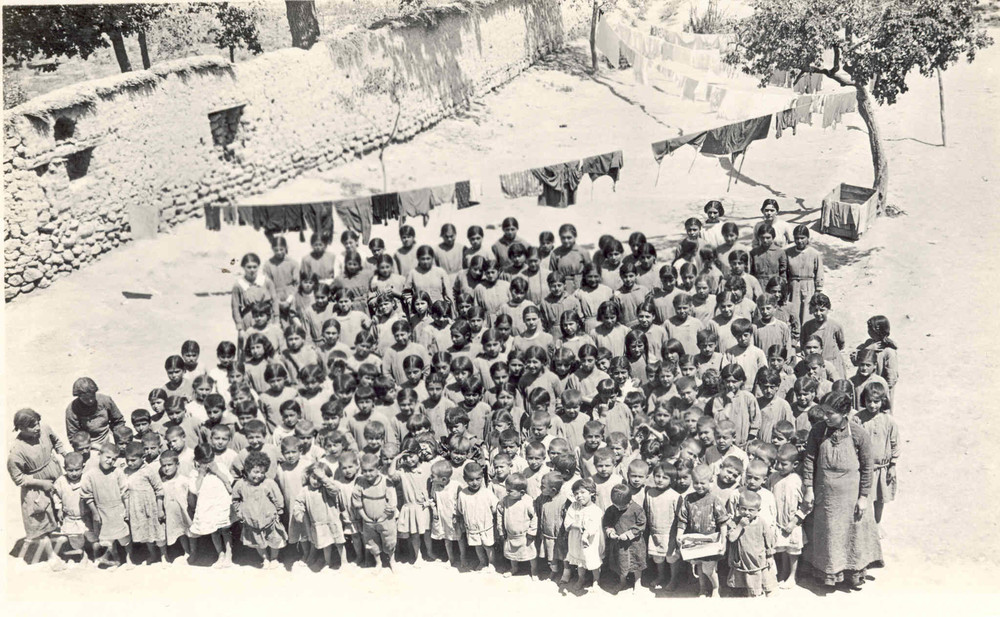 Emma Cushman's girls assemble in the yard. Konia, c. 1919–1920.