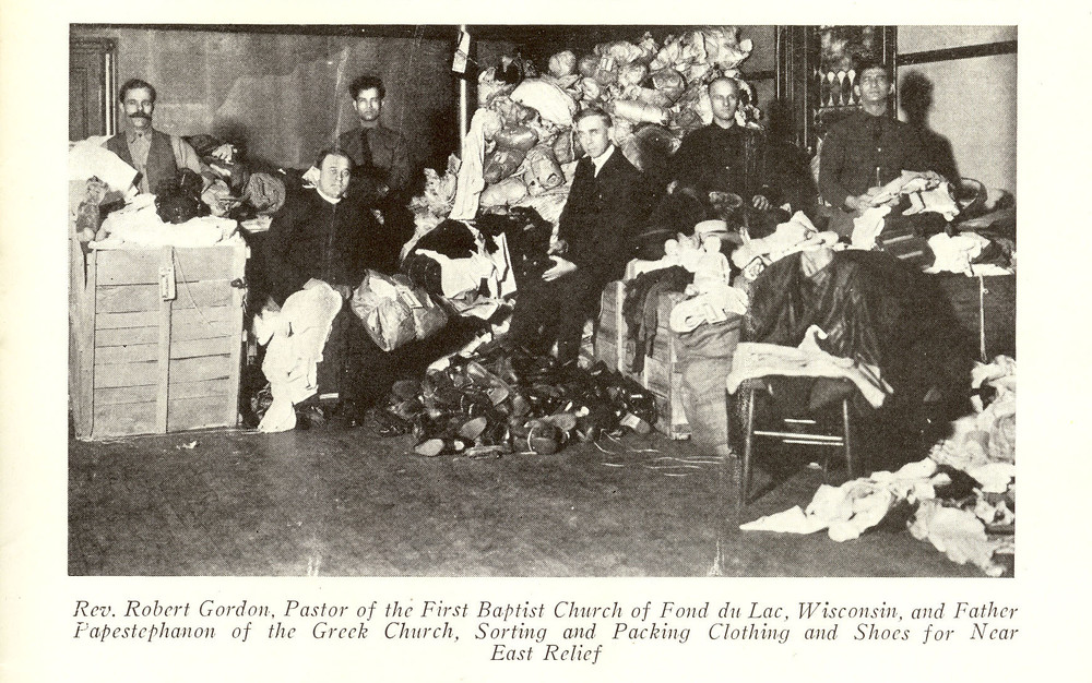 Baptist and Greek Orthodox clergy sort donated clothing for Near East Relief, Fond du Lac, Wisconsin