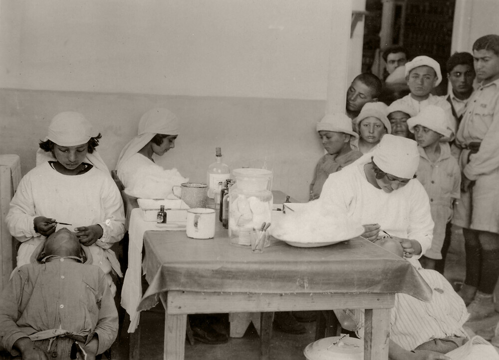 18 - Pupil nurses administering simple remedies.