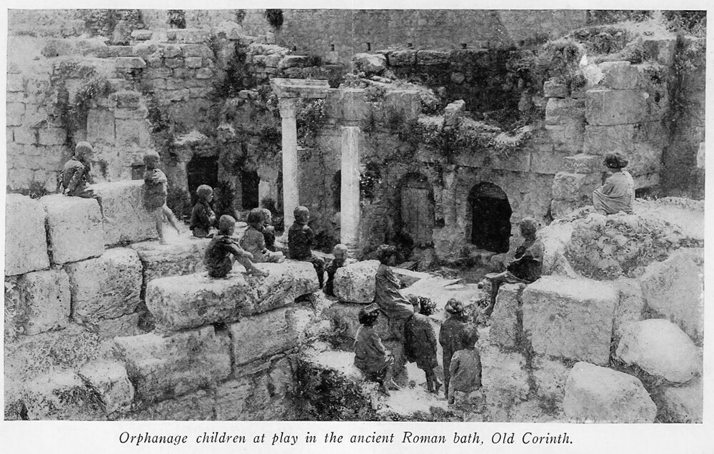 Orphans at play in the ancient Roman bath, Old Corinth, 1927.