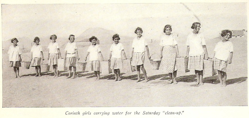 Corinth girls carrying water for the Saturday clean-up, 1926.