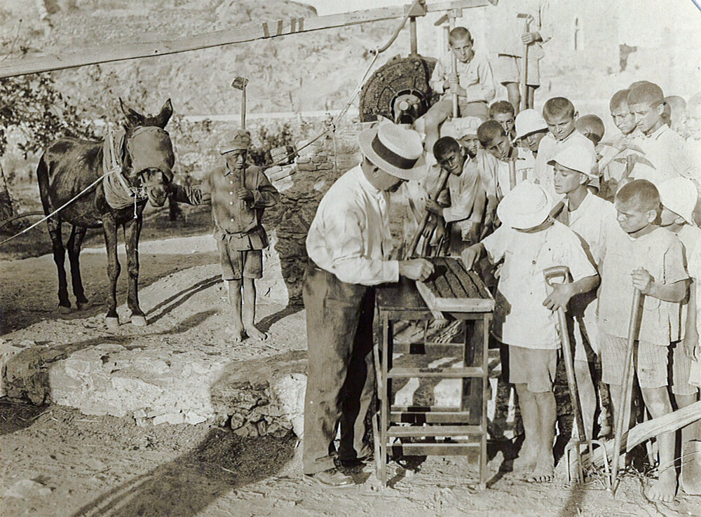 Fred Midgley teaches farm work to orphans. Syra, 1927