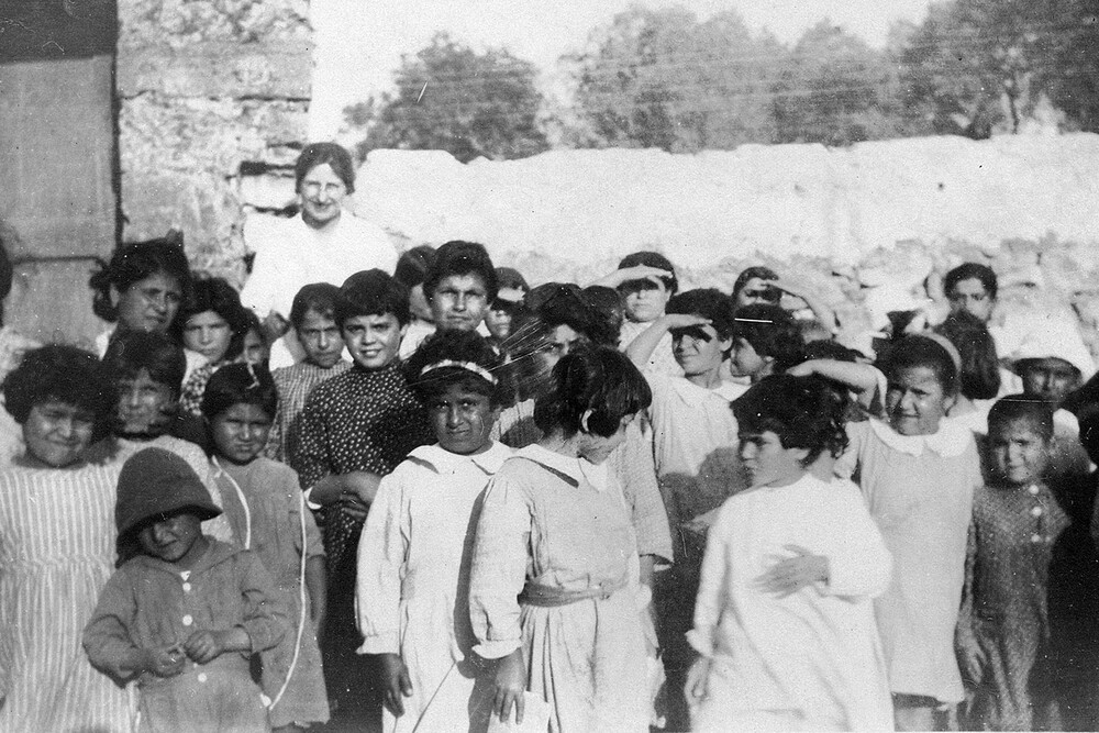 Orphan girls with Nellie Miller Mann at the Seaside Orphanage, Sidon, c. 1921–1923.