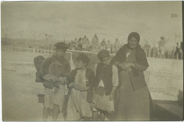 A grandmother arrives with three children. Sidon, c. 1919–1920.