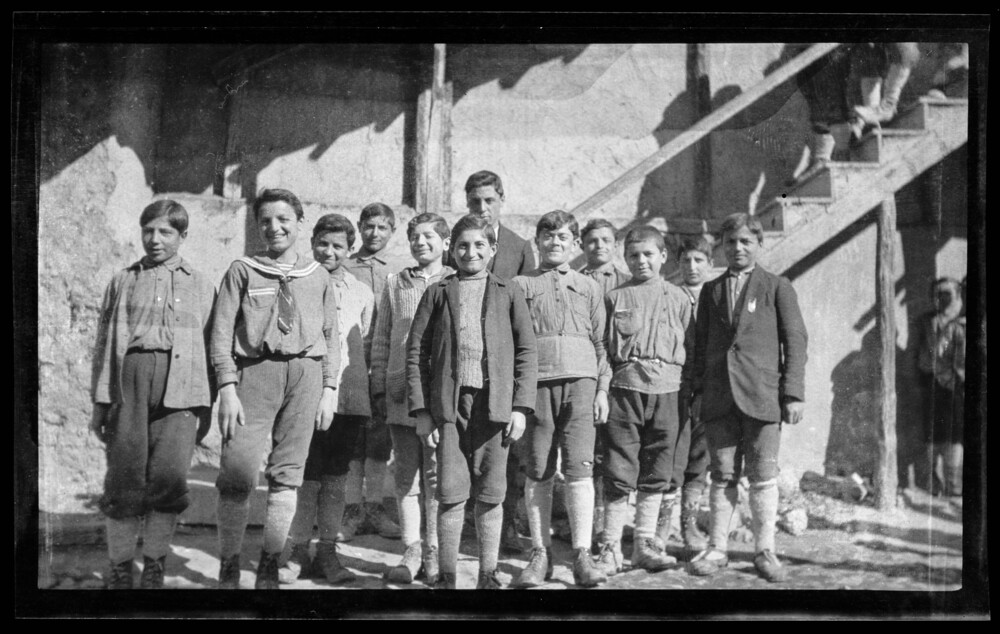 Orphan boys, several smiling, at the staircase wall, Near East Relief boys’ orphanage, Marsovan (Merzifon).