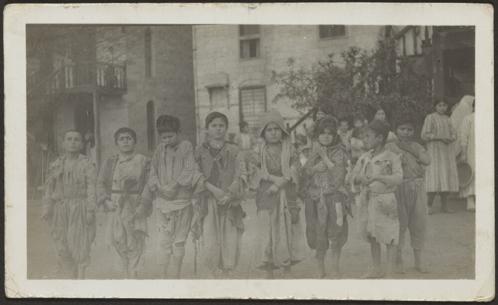 Street children gathered and fed by American relief party, Marash
