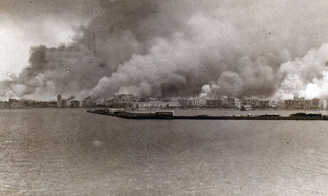 A view of Smyrna burning from across the harbor, September 1922. Image courtesy of the Armenian Genocide Memorial-Institute.