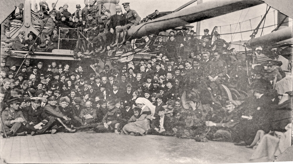Members of the Leviathan Party of Near East Relief workers, en route to the Near East, February–March 1919. NER service stars are visible on the hats of several workers.