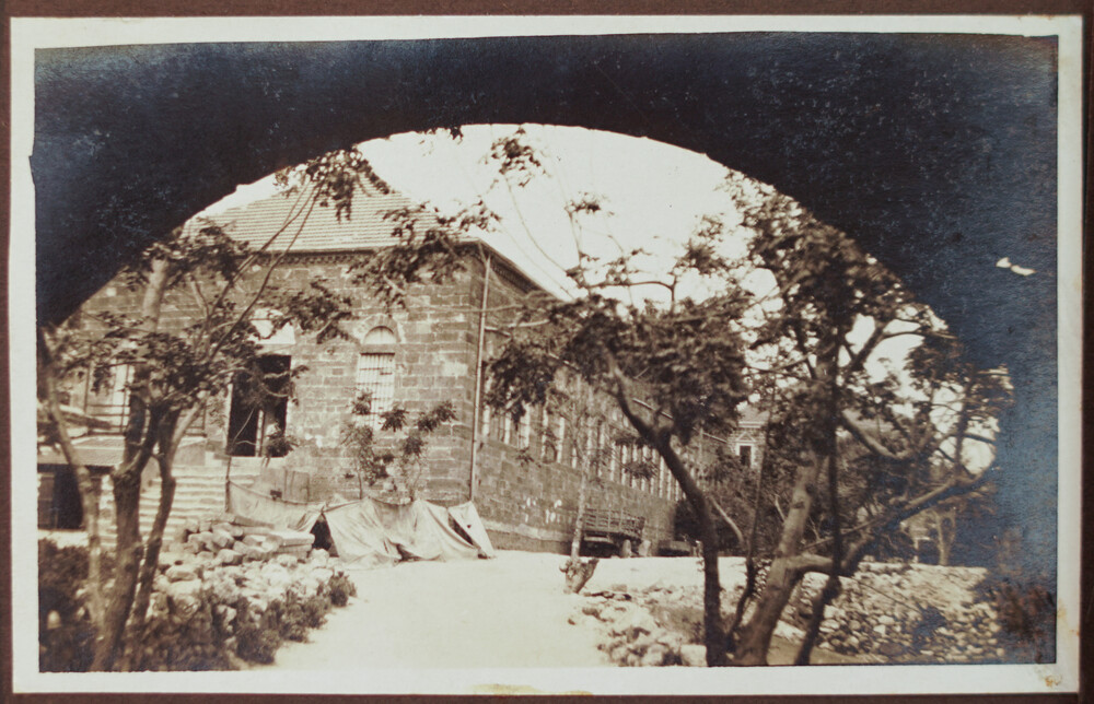Orphanage building through the arch, Jebail, 1922